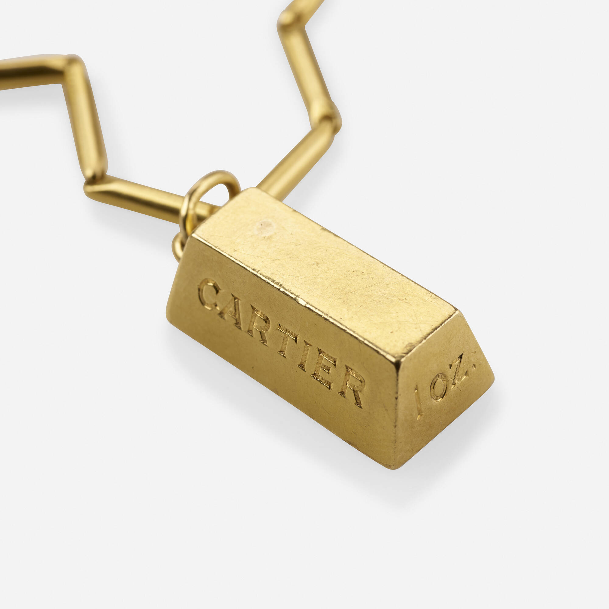 259: CARTIER, 1 oz. gold bar pendant 